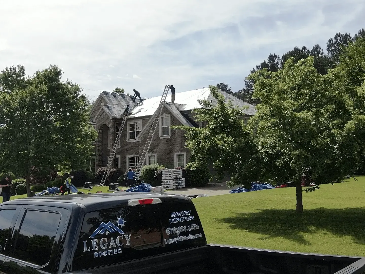 Legacy Roofing Truck at job site